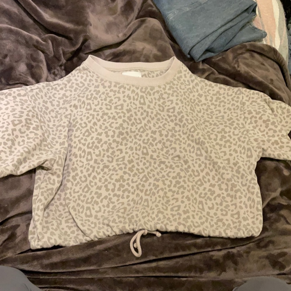 Cheetah print tee shirt with tie At the bottom!